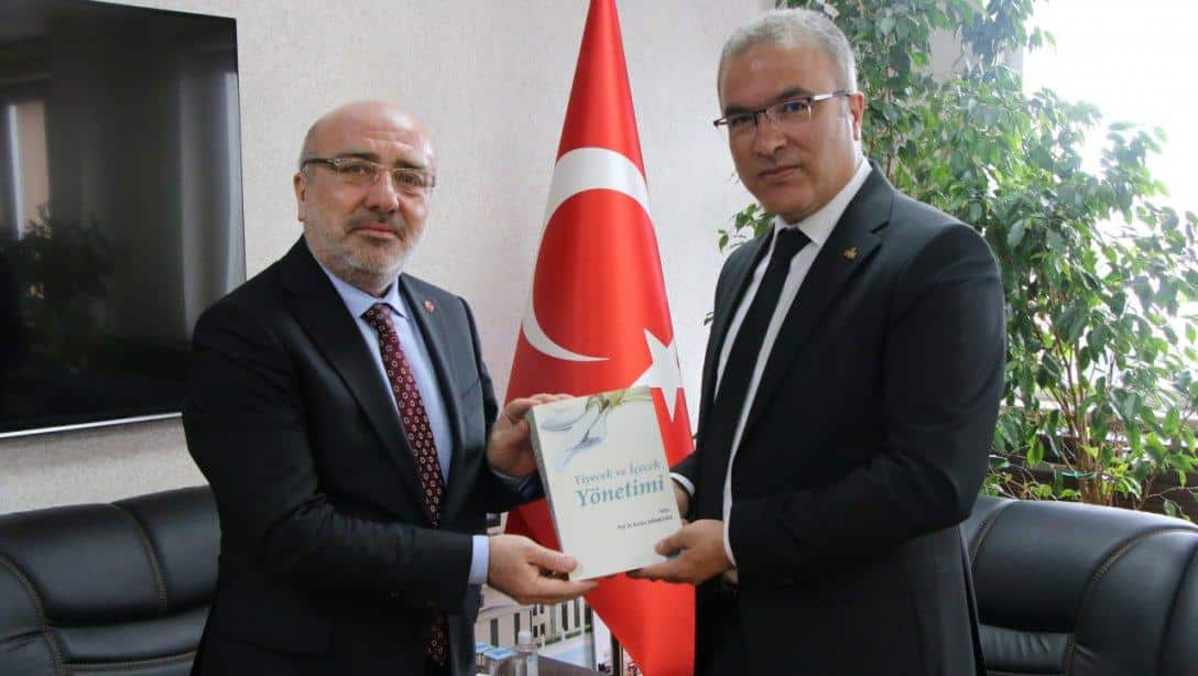 Kayseri Üniversitesi Rektörü Sn.Prof.Dr.Kurtuluş KARAMUSTAFA, İl Milli Eğitim Müdürümüz Sn.Ayhan TELTİK'i Ziyaret Etti